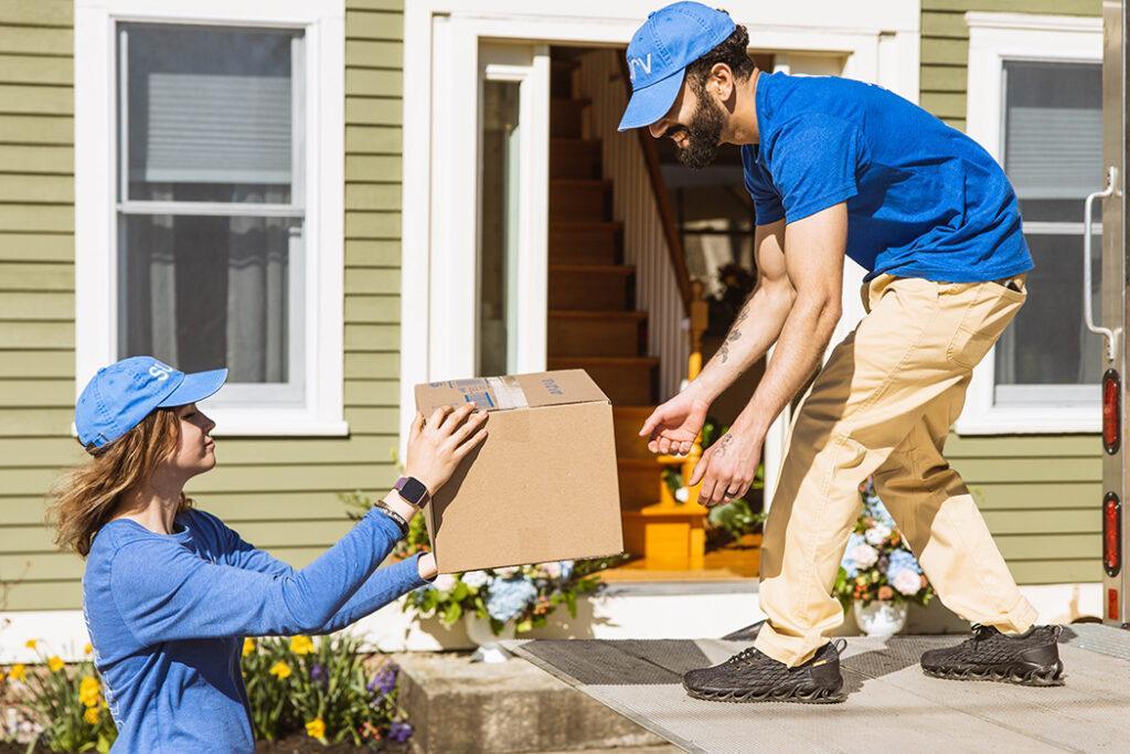 two people and a moving box