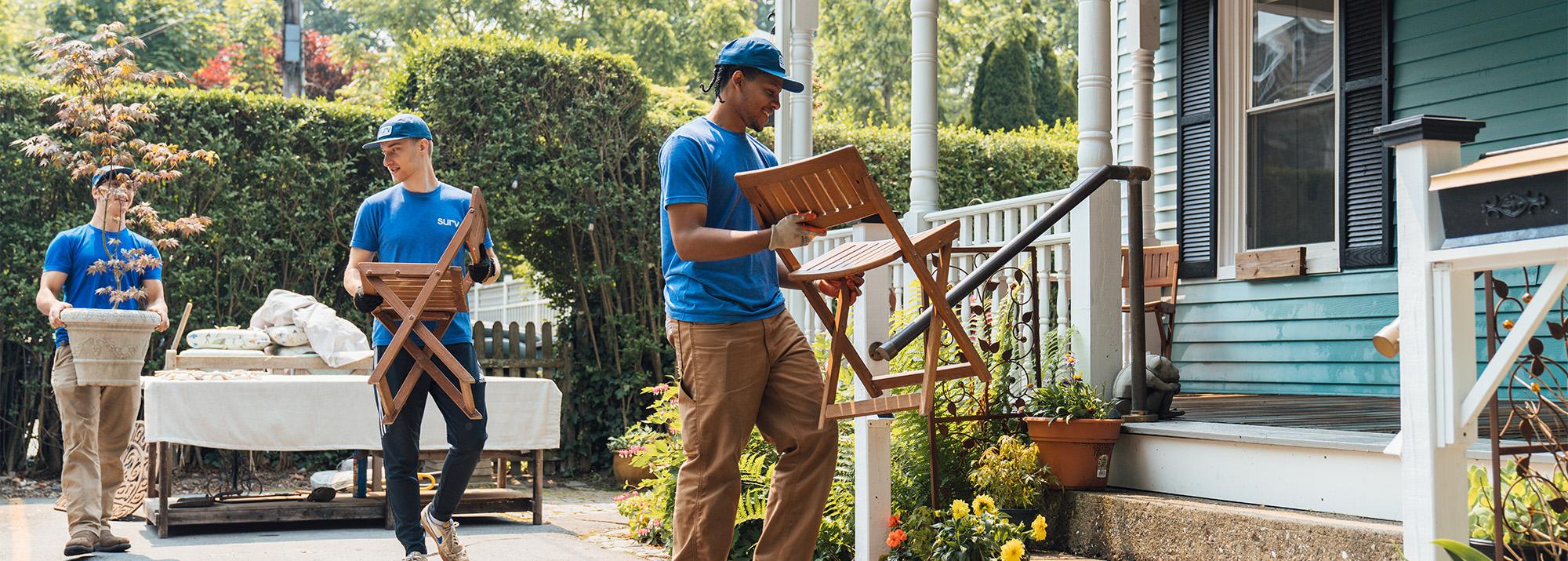 Surv Team moving furniture to a porch