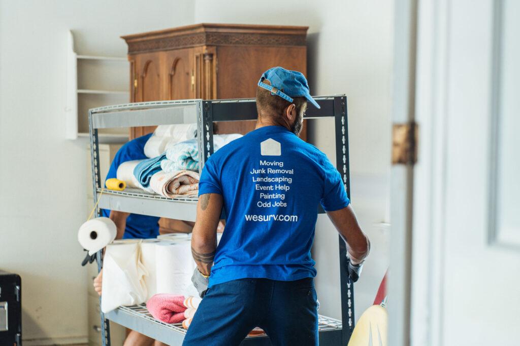 Surv workers moving a shelf