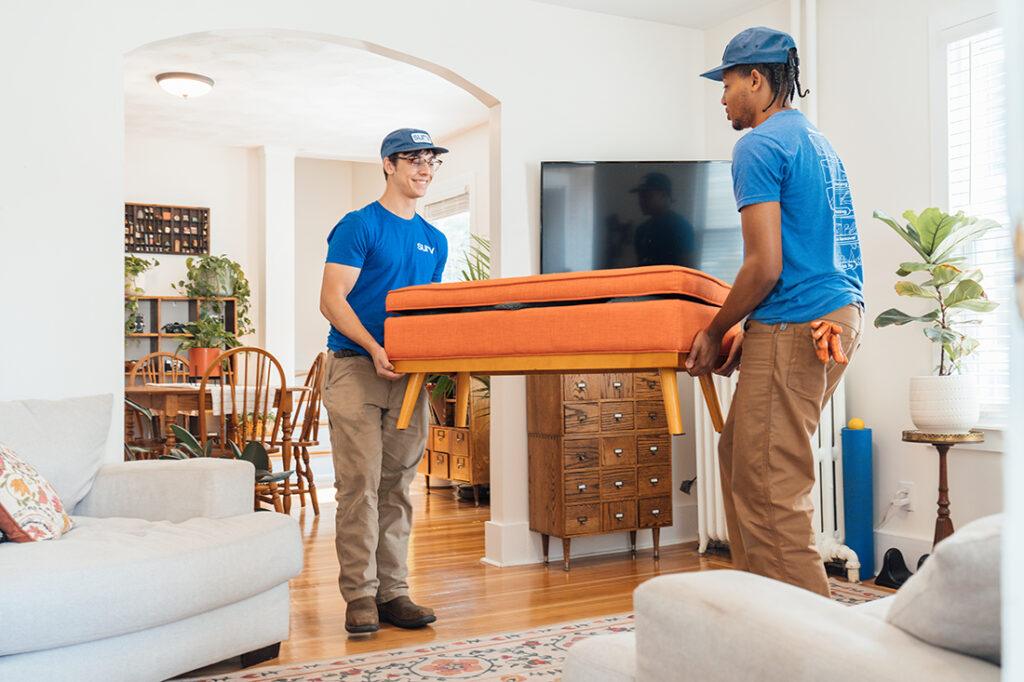 Surv workers rearranging furniture