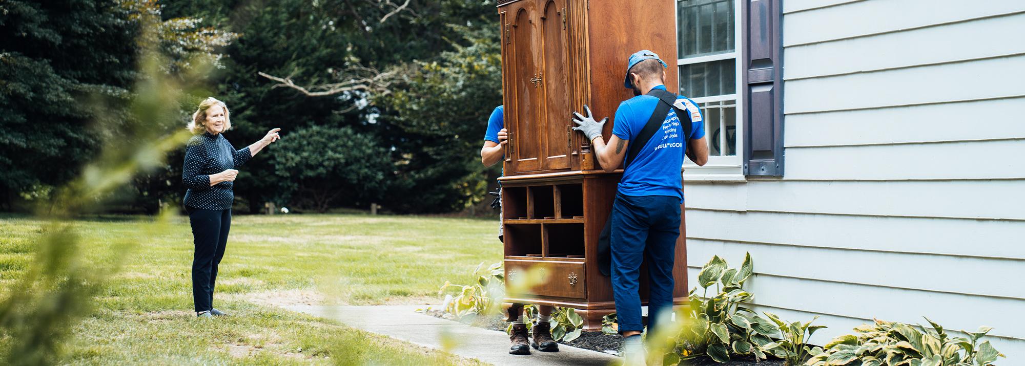 The Surv team helping move a dresser