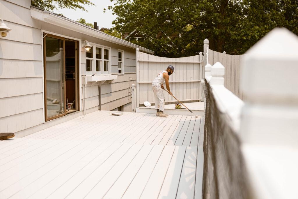 Surv Worker Painting a Deck