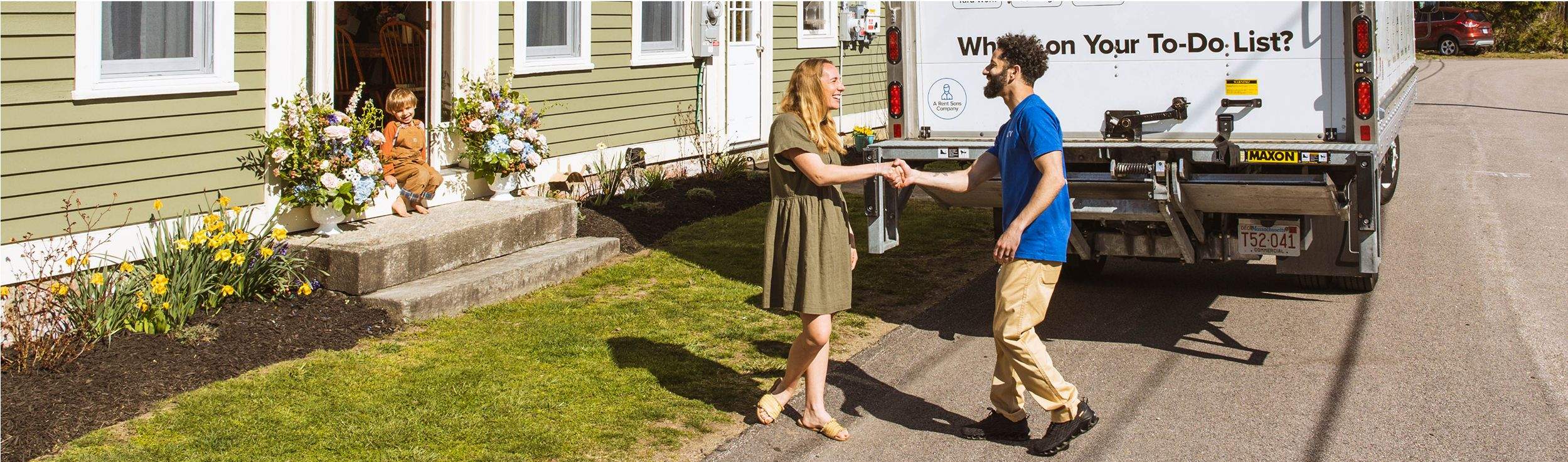 A Surv employee shaking a woman's hand