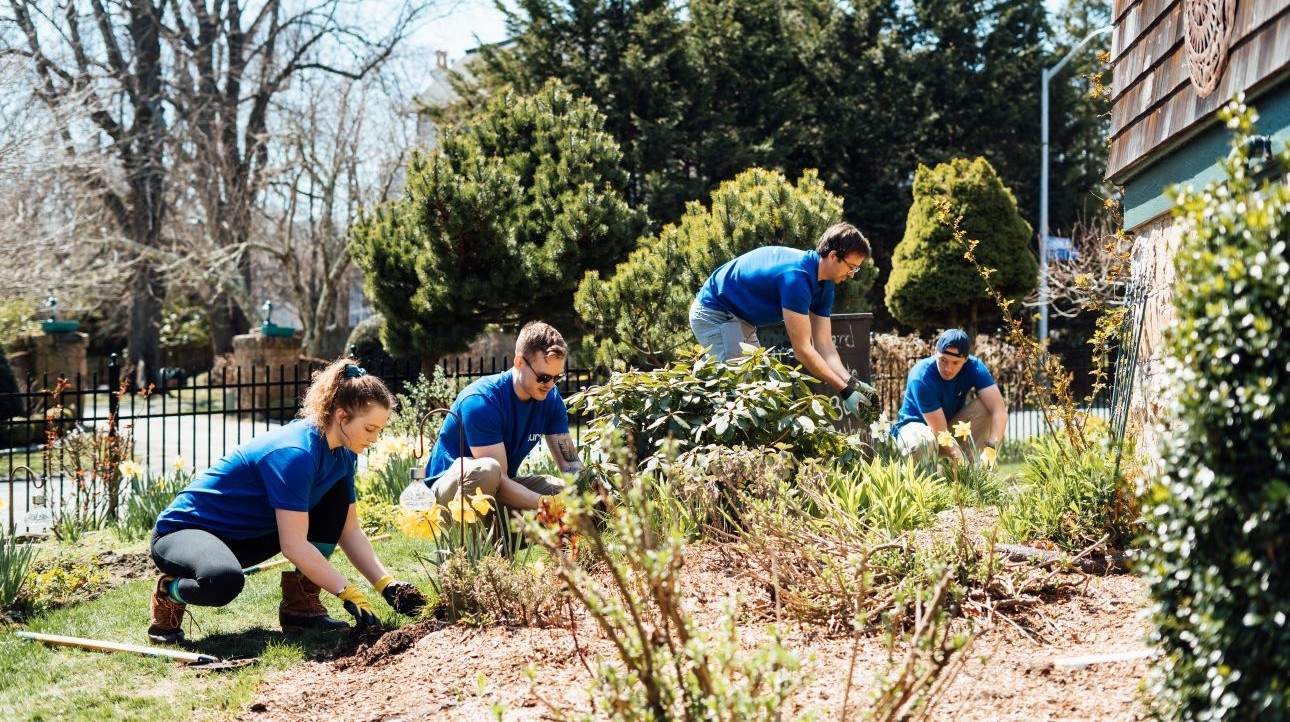 A Surv crew cleaning up a front yard