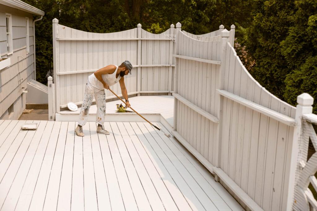 Surv workers painting a deck