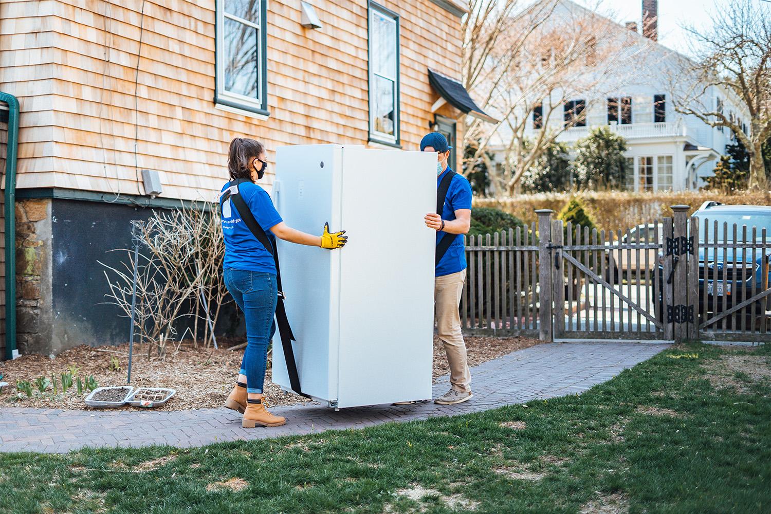Surv team moving out an old fridge
