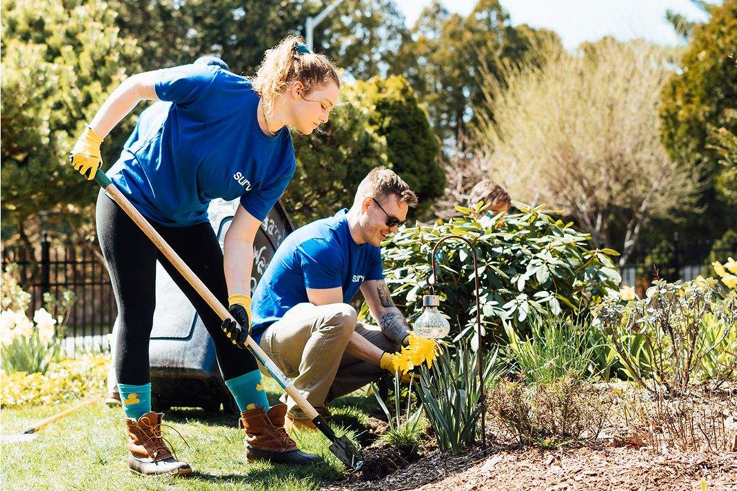 A man and woman gardening