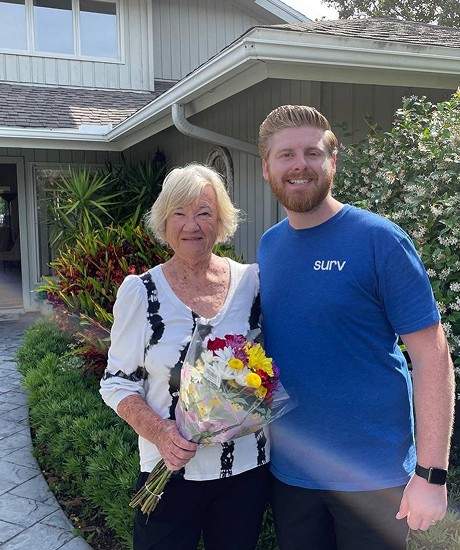 A Surv employee and an elderly woman