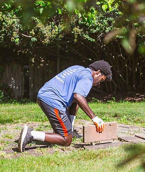 Laying paver stones into a lawn